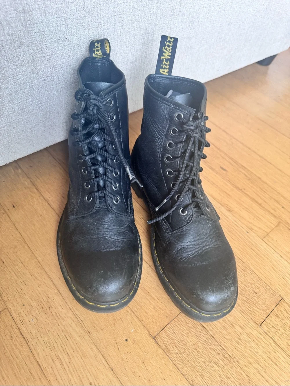 Dr. Martens Black Leather 8-Eye Lace-Up Ankle Boots with Yellow Stitching